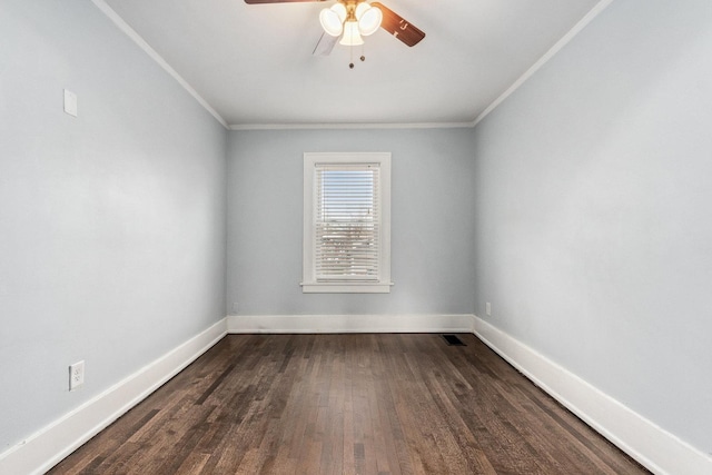 unfurnished room featuring visible vents, ceiling fan, baseboards, dark wood finished floors, and ornamental molding