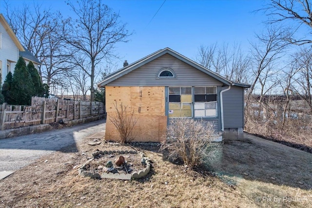 view of outdoor structure with fence