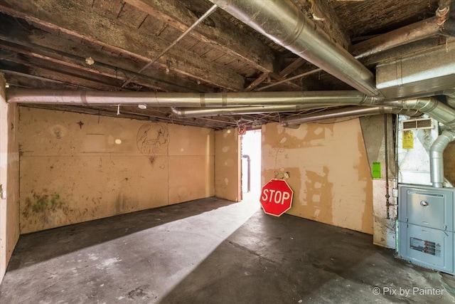 basement with heating unit and visible vents