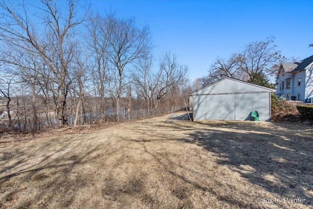 view of yard featuring an outbuilding and an outdoor structure