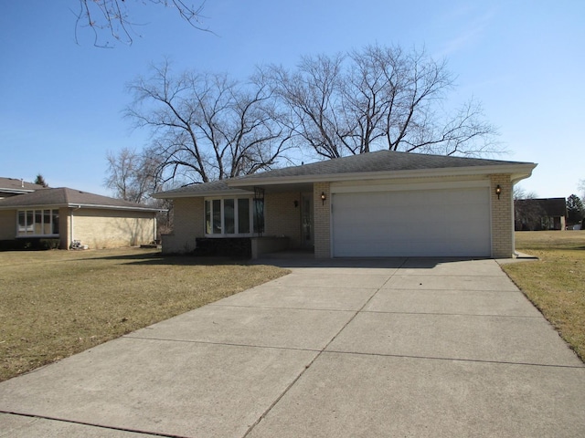 single story home featuring a front yard, a garage, brick siding, and driveway