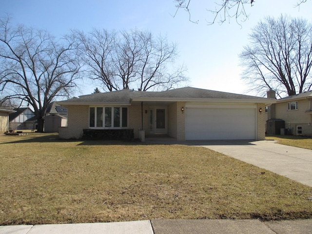 ranch-style house featuring brick siding, an attached garage, driveway, and a front yard