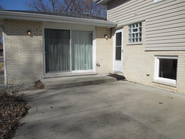 property entrance with a patio area