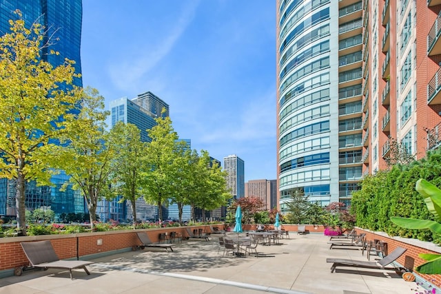 view of community featuring a view of city and a patio