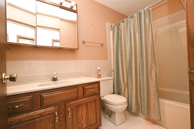 full bathroom featuring toilet, a textured ceiling, tile walls, shower / tub combo, and vanity