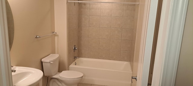 full bath with toilet, bathtub / shower combination, and a sink