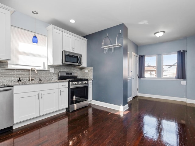 8018 S Luella Ave, Chicago, IL 60617 - kitchen featuring a sink, stainless steel appliances, tasteful backsplash, and dark wood-style floors