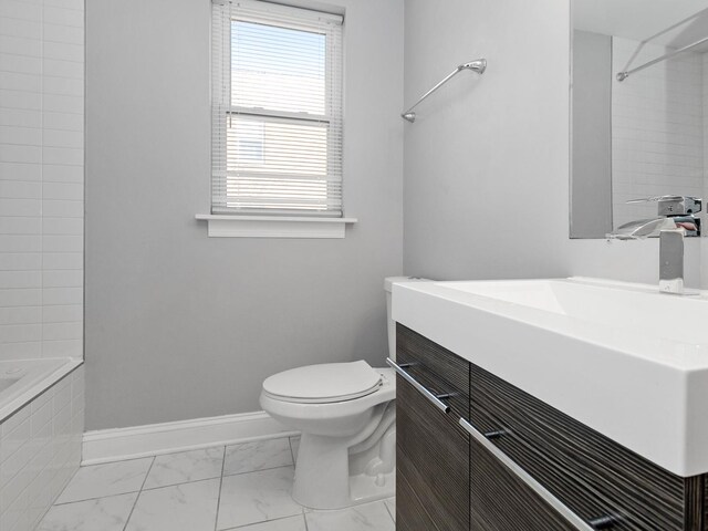 full bathroom featuring marble finish floor, toilet, vanity, and baseboards