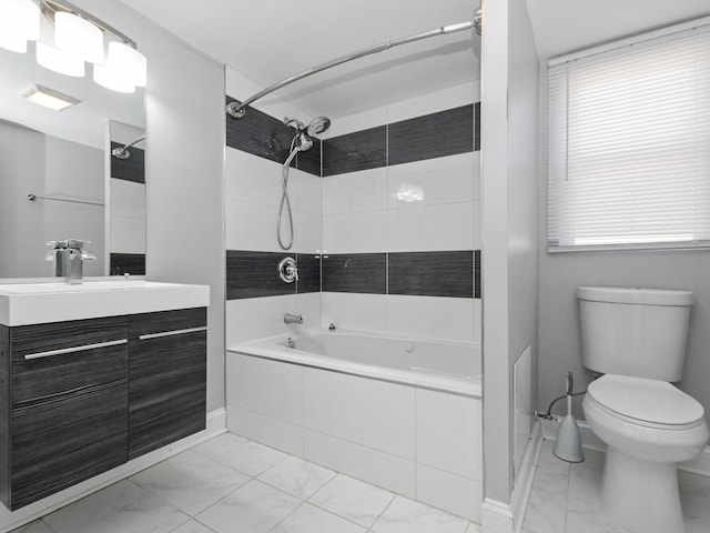 8018 S Luella Ave, Chicago, IL 60617 - bathroom with vanity, toilet, marble finish floor, and tiled shower / bath combo