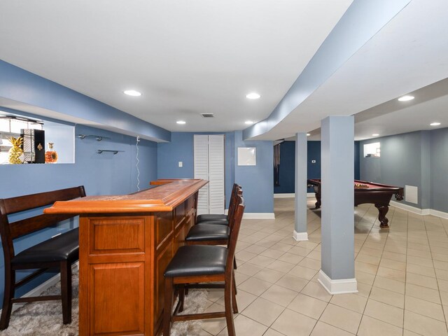 bar featuring a dry bar, light tile patterned floors, recessed lighting, and baseboards