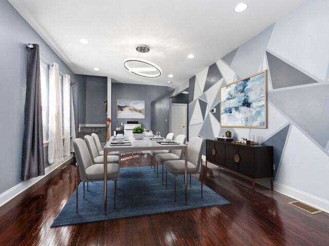 kitchen featuring a sink, stainless steel appliances, tasteful backsplash, and dark wood-style floors