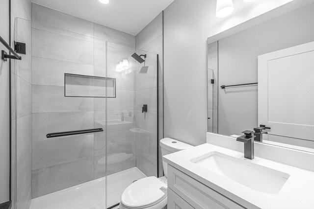 3308 S Leavitt St, Chicago, IL 60608 - bathroom featuring vanity, toilet, and a shower stall