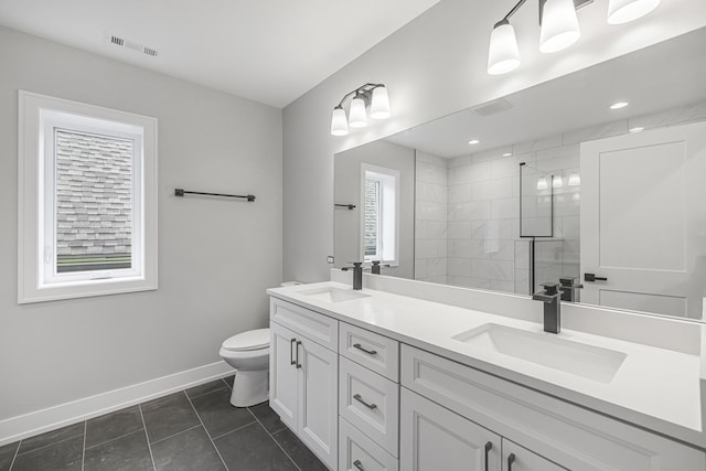 3308 S Leavitt St, Chicago, IL 60608 - bathroom featuring visible vents, a sink, toilet, and tiled shower