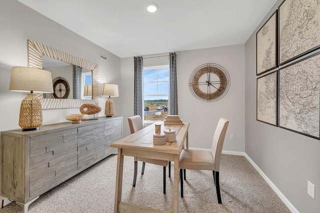 home office featuring light colored carpet and baseboards