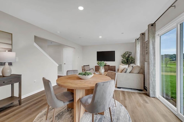 dining area with visible vents, recessed lighting, baseboards, and light wood-style floors