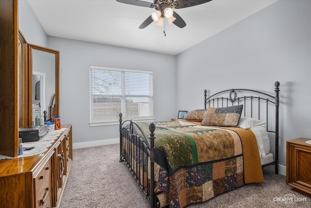 bedroom with baseboards, light colored carpet, and a ceiling fan