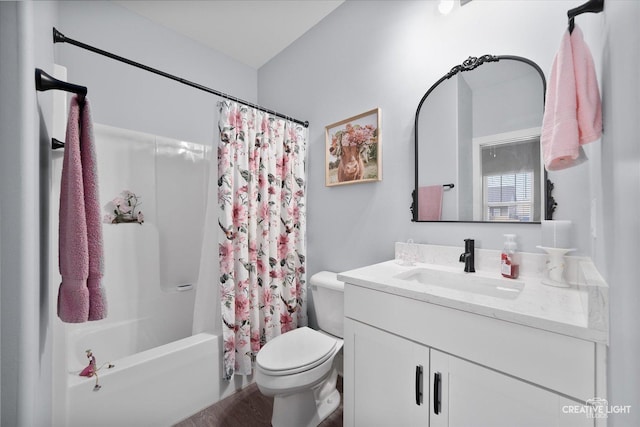 bathroom featuring toilet, vanity, and shower / bath combo