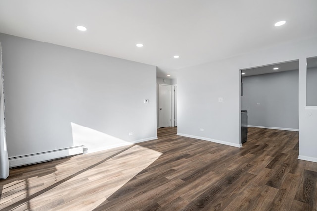 unfurnished room featuring recessed lighting, a baseboard radiator, and dark wood-type flooring