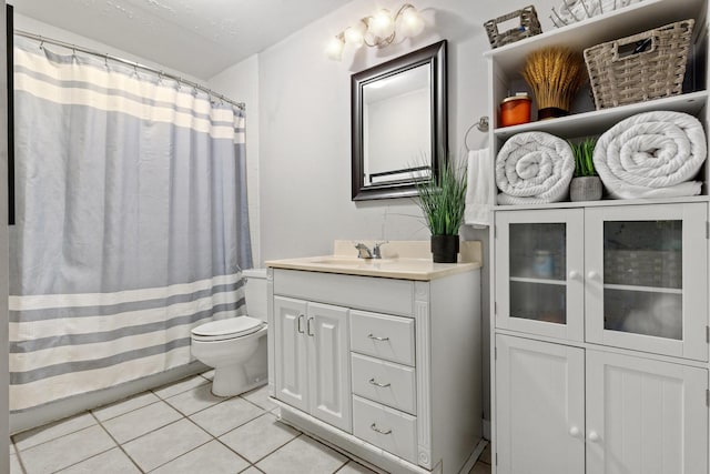 full bath featuring toilet, a shower with curtain, tile patterned flooring, and vanity