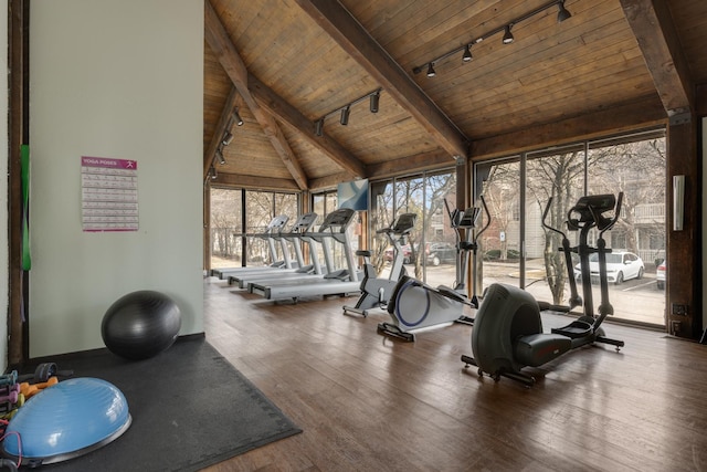 exercise room featuring rail lighting, vaulted ceiling, wood ceiling, and wood finished floors