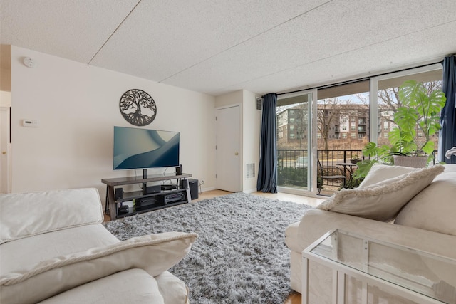 living room featuring a textured ceiling and visible vents