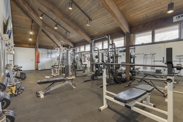 workout area featuring wooden ceiling, rail lighting, and high vaulted ceiling