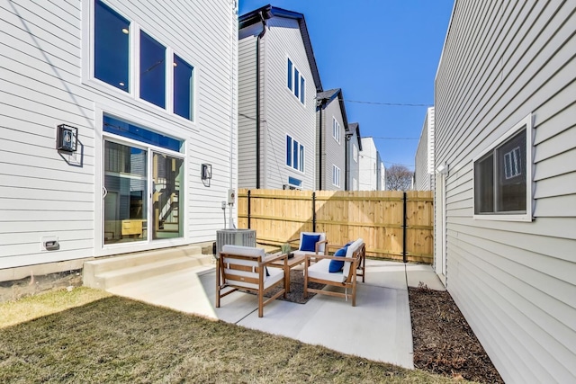 view of patio / terrace featuring fence