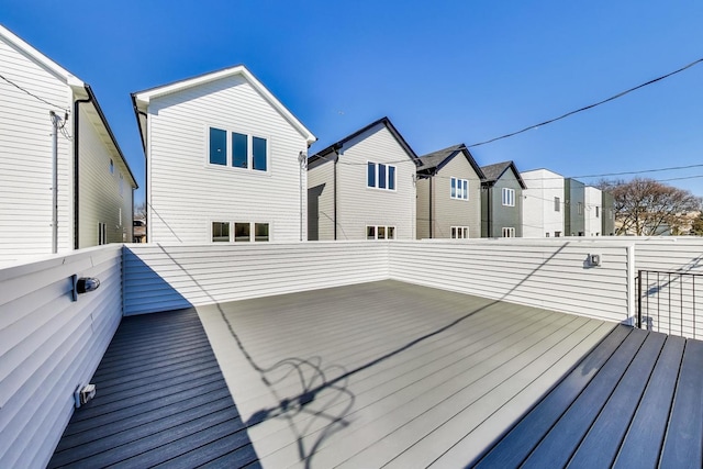 wooden deck featuring a residential view