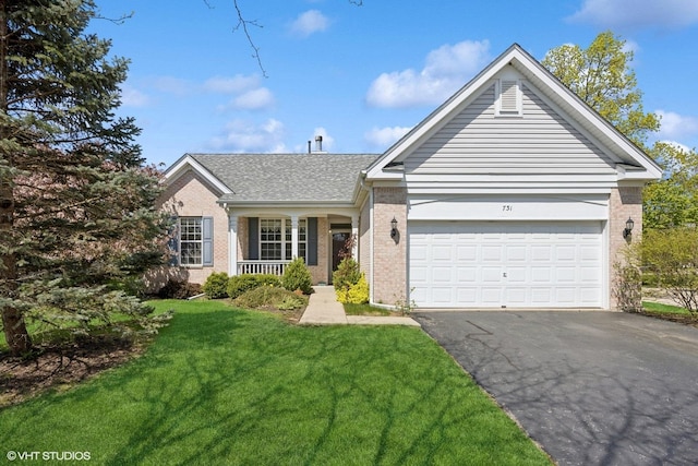 731 Norwich Ct, Crystal Lake, IL 60012 - single story home with brick siding, driveway, a front lawn, a garage, and a shingled roof
