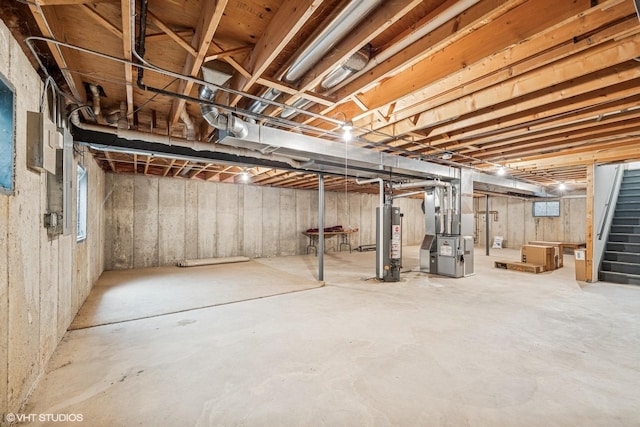 731 Norwich Ct, Crystal Lake, IL 60012 - unfinished below grade area with gas water heater, heating unit, and stairway