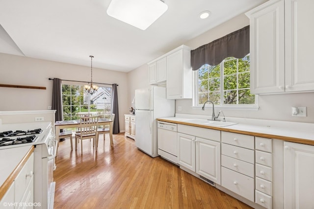 731 Norwich Ct, Crystal Lake, IL 60012 - kitchen featuring a sink, white appliances, a chandelier, white cabinetry, and recessed lighting