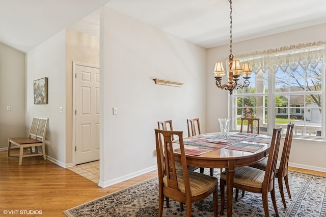 731 Norwich Ct, Crystal Lake, IL 60012 - dining area with a chandelier, light wood finished floors, and baseboards