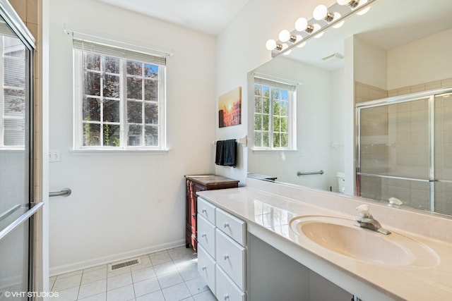 731 Norwich Ct, Crystal Lake, IL 60012 - full bathroom featuring tile patterned floors, tiled shower, vanity, and baseboards