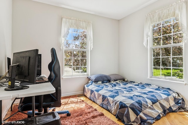 731 Norwich Ct, Crystal Lake, IL 60012 - bedroom featuring wood finished floors, an office area, and baseboards
