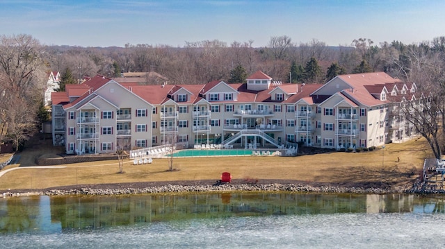 birds eye view of property featuring a water view