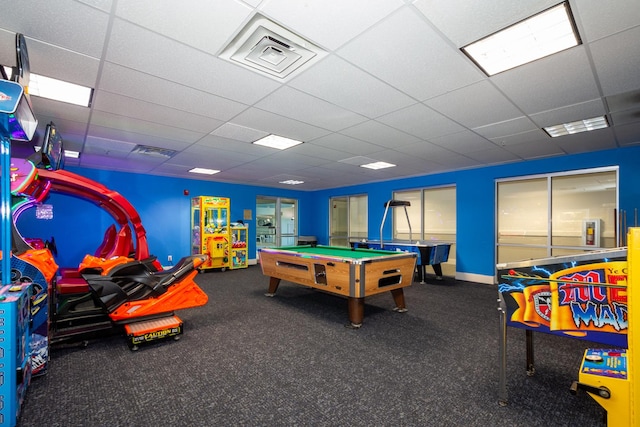 recreation room with visible vents, a paneled ceiling, and baseboards