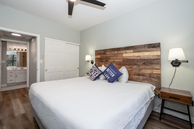 bedroom with connected bathroom, a closet, wood finished floors, and a ceiling fan