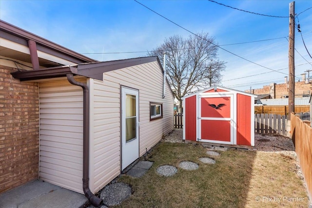 view of shed with fence