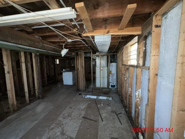 basement with gas water heater and washer / clothes dryer