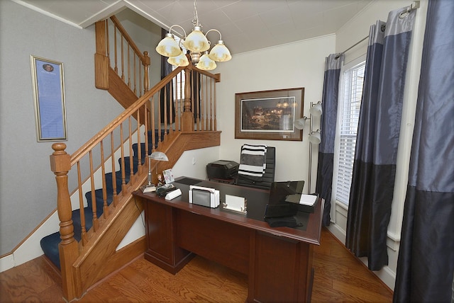 office area with a notable chandelier, wood finished floors, baseboards, and ornamental molding