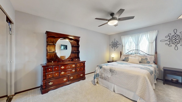 bedroom with baseboards, carpet, and ceiling fan