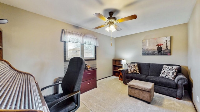 office area featuring light colored carpet and a ceiling fan