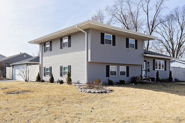 split level home featuring driveway and a front yard