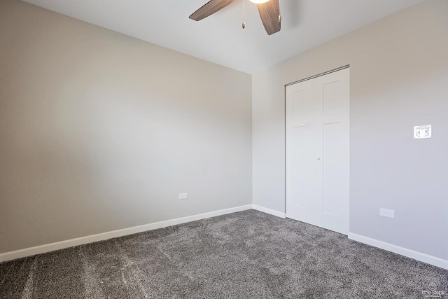 unfurnished bedroom with baseboards, carpet floors, and a ceiling fan