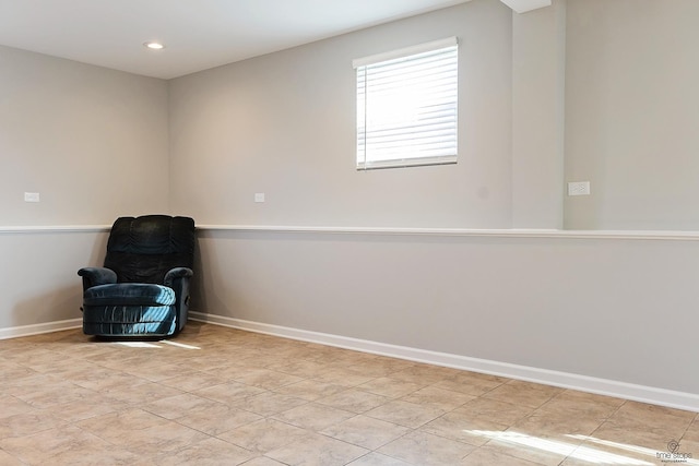 unfurnished room featuring recessed lighting and baseboards