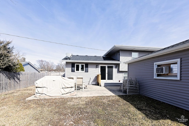 back of property featuring a fenced backyard, cooling unit, and a patio