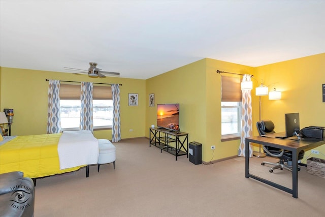 bedroom featuring multiple windows, baseboards, and carpet