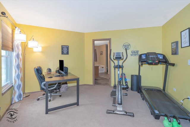 exercise room featuring baseboards