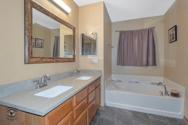 bathroom with double vanity, a garden tub, and a sink