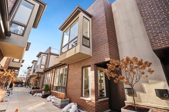 view of home's exterior featuring brick siding